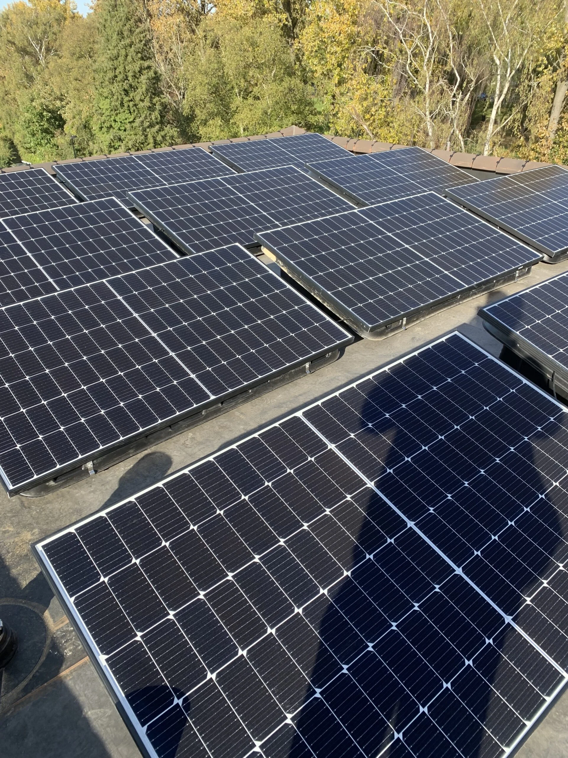 Multiple solar panels on flat roof