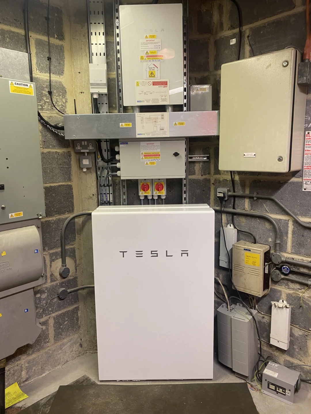 Tesla powerwall in corner of garage