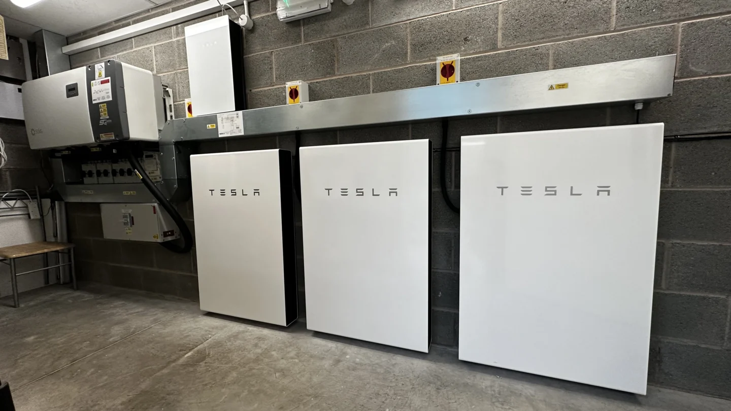 Three tesla batteries in industrial garage