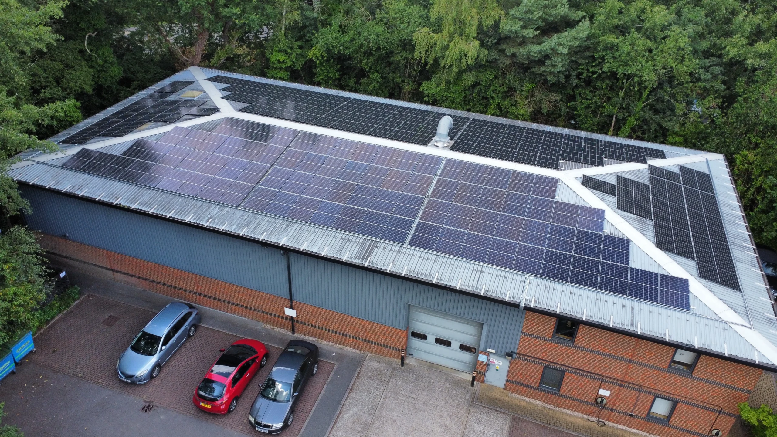 Aerial view of large solar panel installation on roof