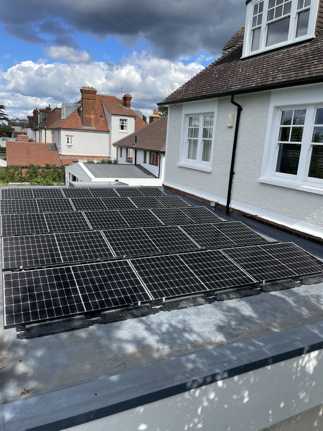 Multiple solar panels on flat roof