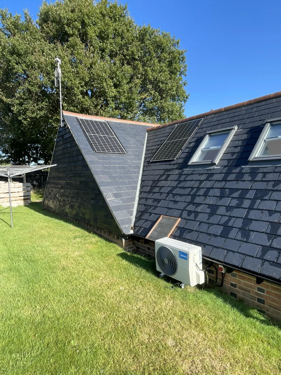 Large residential home with solar panels on multiple roofs