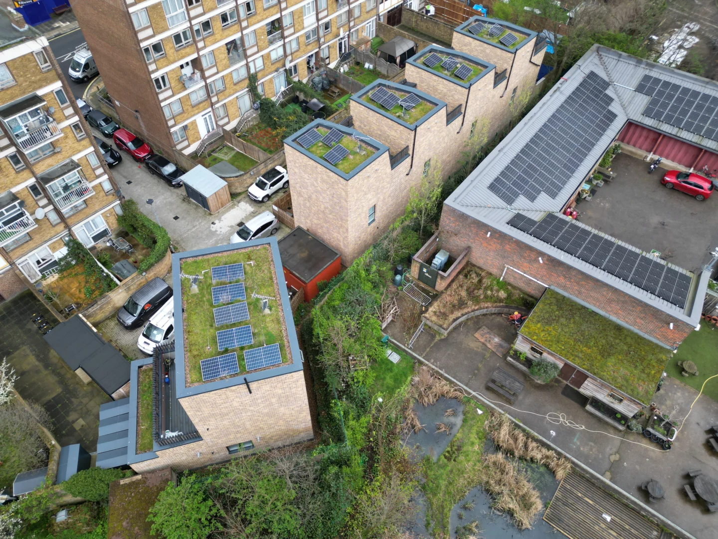 Aerial view of solar panels on roofs of modern residential development