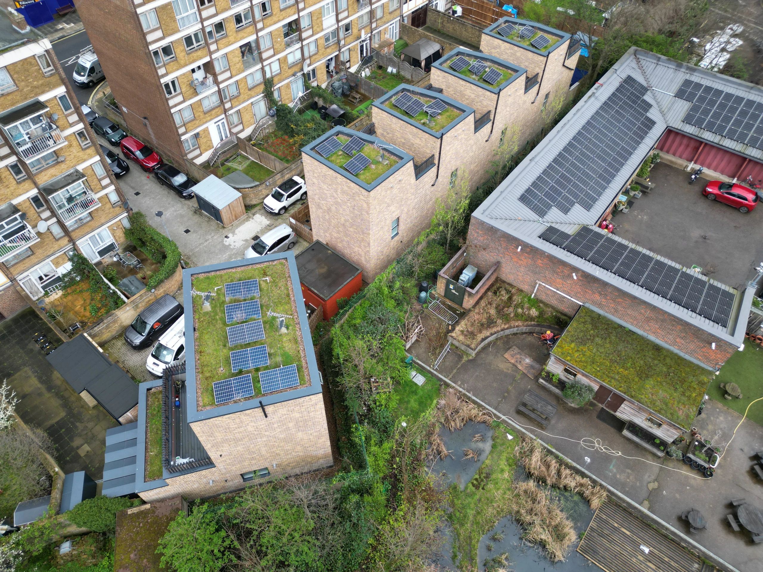 Aerial view of solar panels on roofs of modern residential development