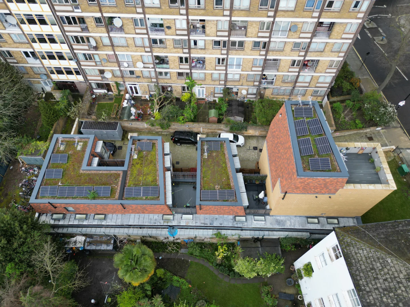 Aerial view of solar panels on roofs of modern residential development